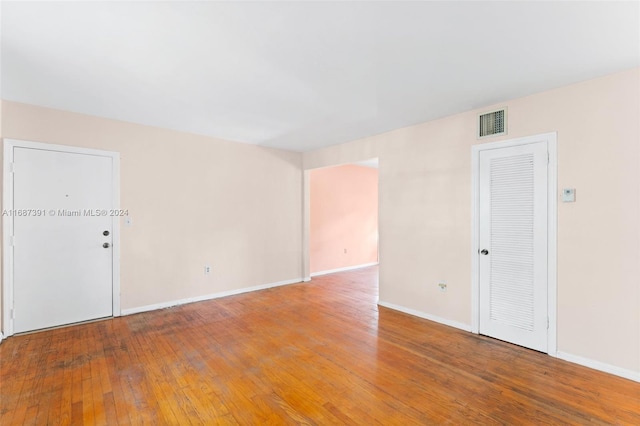 empty room featuring hardwood / wood-style flooring