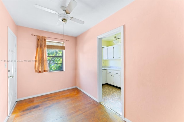 unfurnished room featuring hardwood / wood-style floors and ceiling fan