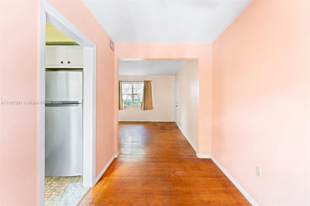 hallway with wood-type flooring