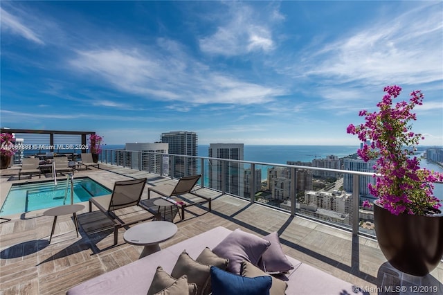 balcony featuring a water view