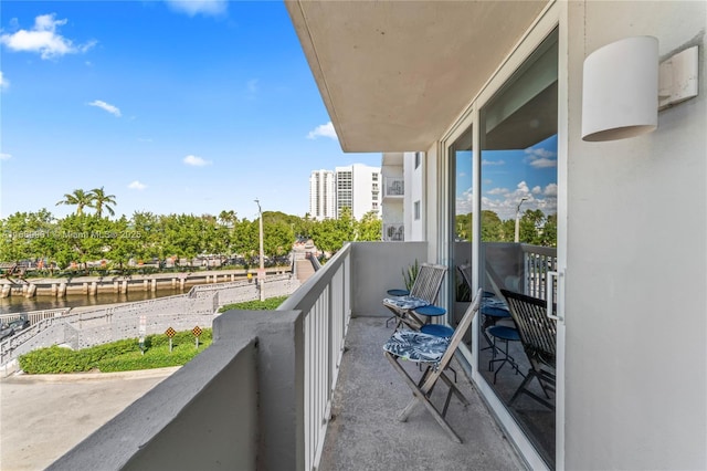 balcony featuring a water view