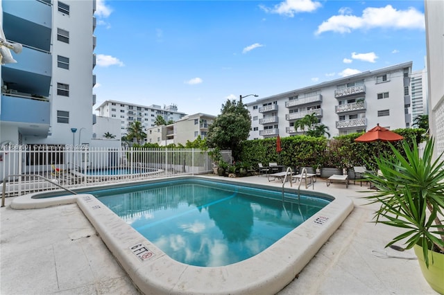 view of swimming pool featuring a patio