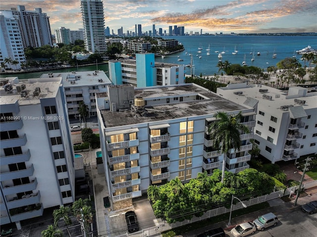 aerial view at dusk with a water view