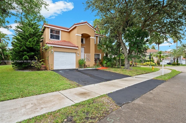 view of front of house with a garage and a front yard