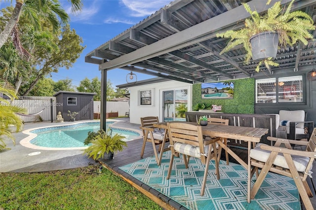 view of pool with a shed