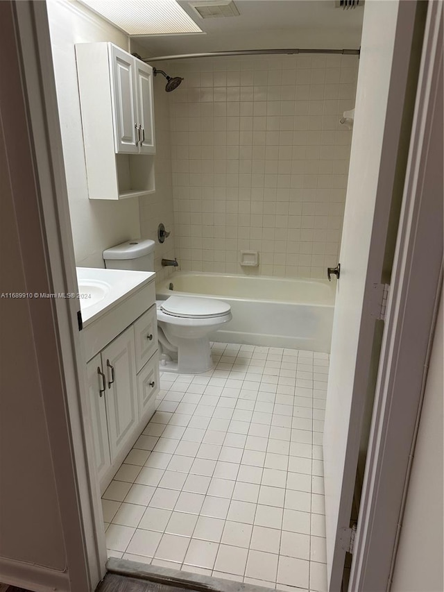 full bathroom with tile patterned flooring, vanity, toilet, and tiled shower / bath