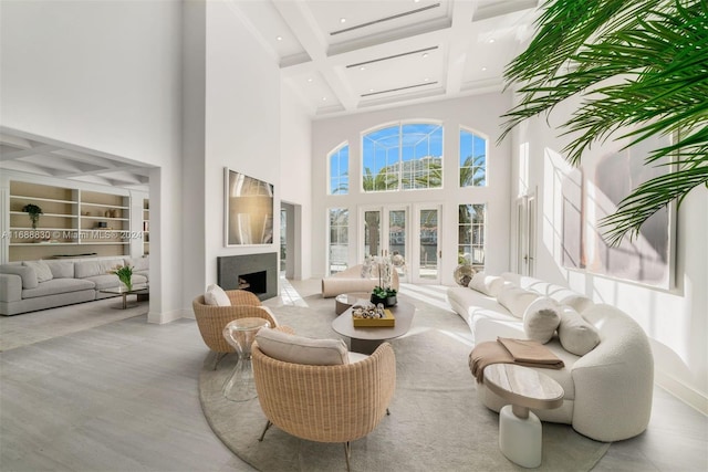 sunroom featuring coffered ceiling and beam ceiling