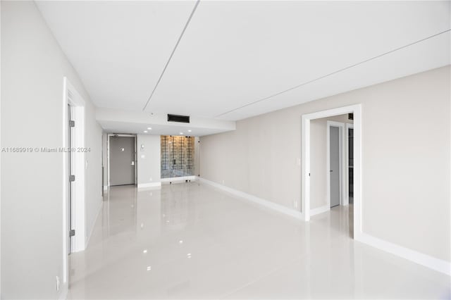 unfurnished room with light tile patterned floors