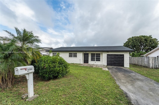 single story home with a garage and a front yard