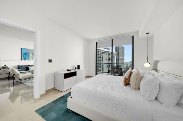 bedroom featuring a wall of windows