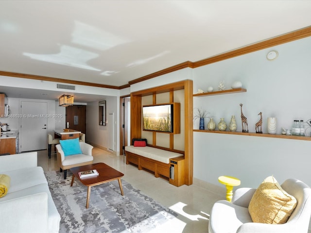 living room with visible vents, baseboards, and ornamental molding