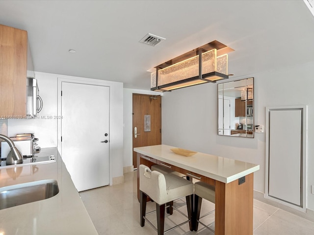 kitchen featuring sink and kitchen peninsula