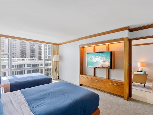 bedroom with light colored carpet and crown molding