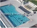 view of swimming pool featuring a hot tub