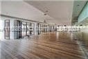 exercise room with wood-type flooring