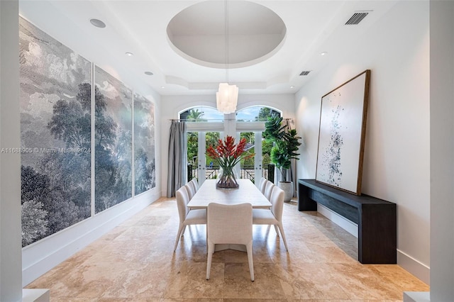 dining area featuring a tray ceiling