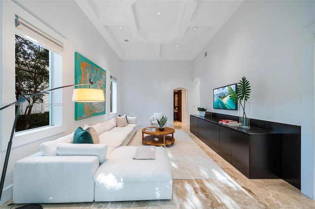 living room featuring a towering ceiling