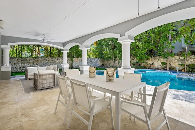 view of patio / terrace featuring outdoor lounge area, ceiling fan, and a fenced in pool