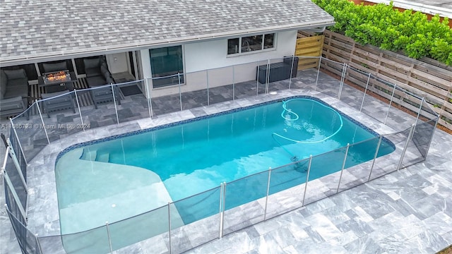 view of swimming pool featuring a patio area