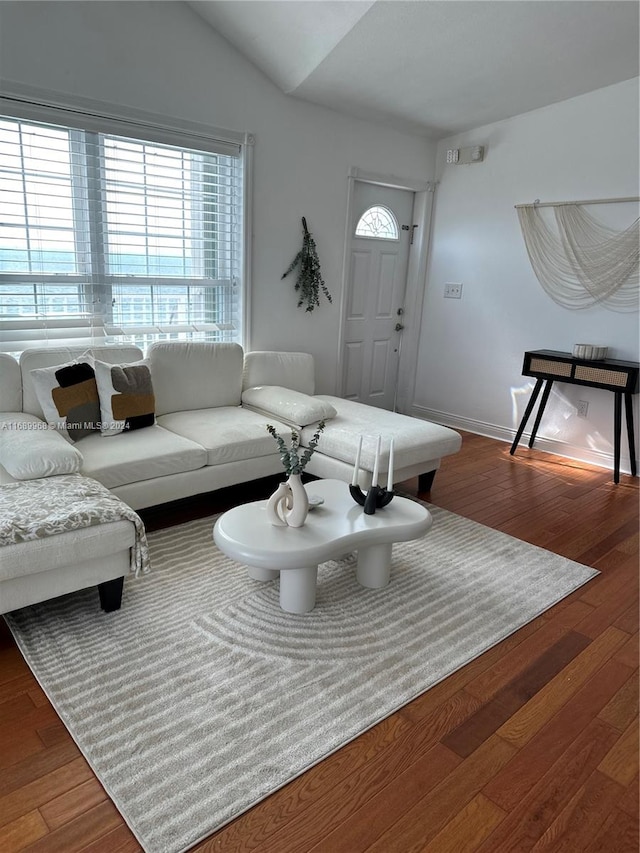 living room with lofted ceiling and hardwood / wood-style flooring