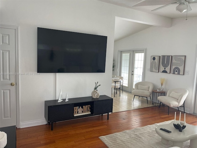 living room with ceiling fan, hardwood / wood-style flooring, french doors, and lofted ceiling with beams