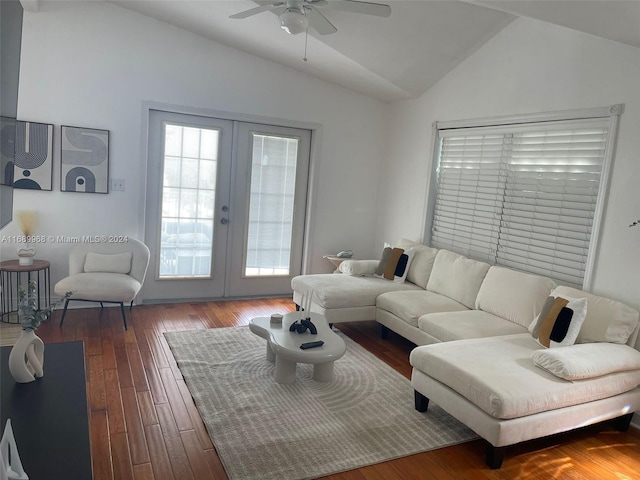 living room with hardwood / wood-style floors, ceiling fan, french doors, and vaulted ceiling