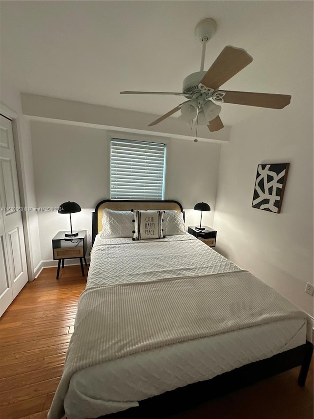 bedroom featuring light hardwood / wood-style flooring and ceiling fan