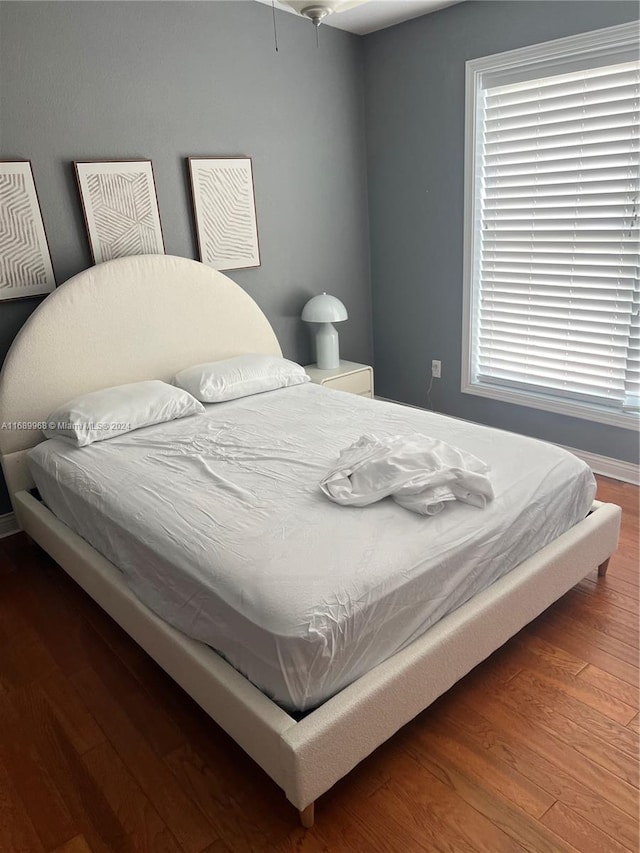 bedroom featuring dark wood-type flooring