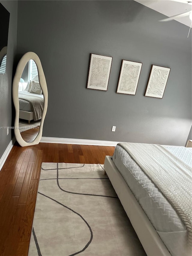 bedroom featuring ceiling fan and wood-type flooring