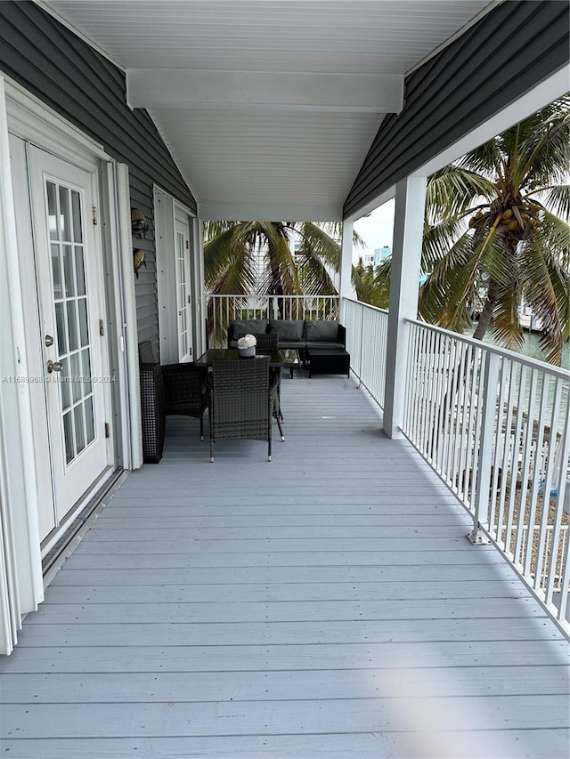 wooden deck featuring outdoor lounge area