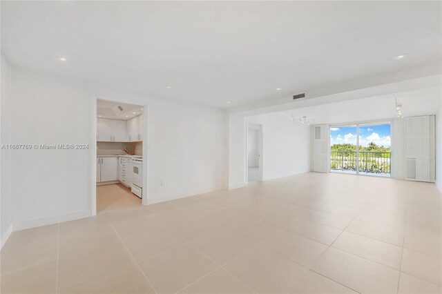 210 Sea View Dr Unit 409, Key Biscayne, FL 33149 - empty room with recessed lighting, light tile patterned floors, and baseboards