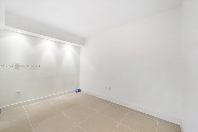 210 Sea View Dr Unit 409, Key Biscayne, FL 33149 - spare room featuring baseboards, light tile patterned flooring, and recessed lighting