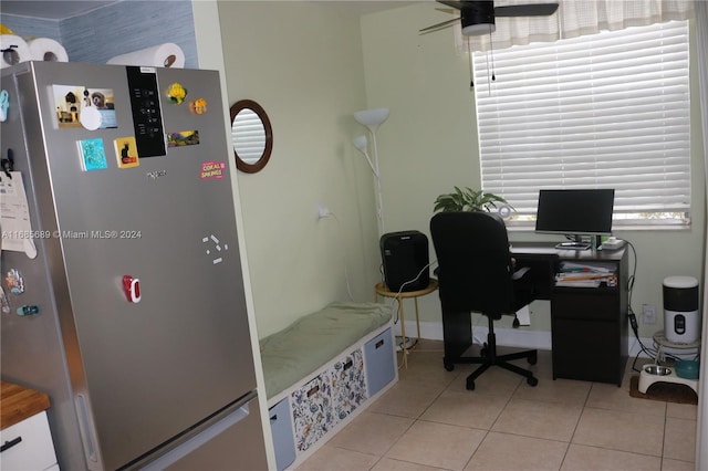 office space featuring ceiling fan and light tile patterned floors