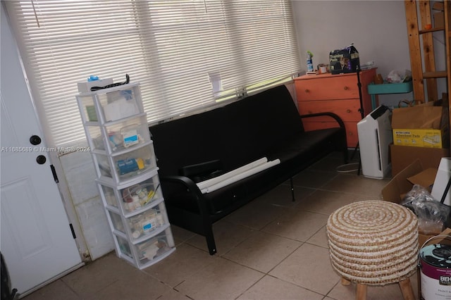 miscellaneous room with light tile patterned floors