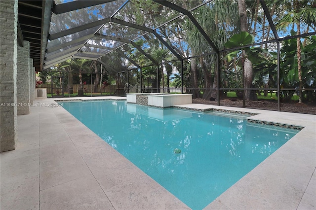 view of pool featuring a lanai and a patio area