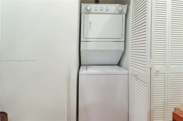 washroom with stacked washer and clothes dryer