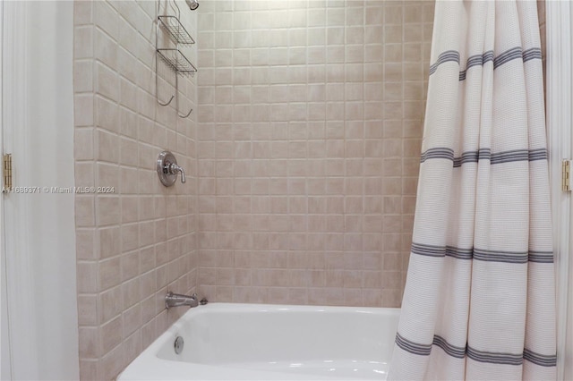 bathroom featuring shower / bath combo with shower curtain