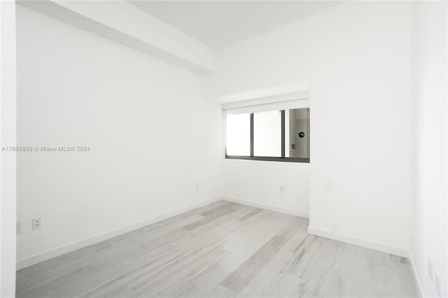 spare room featuring light hardwood / wood-style flooring