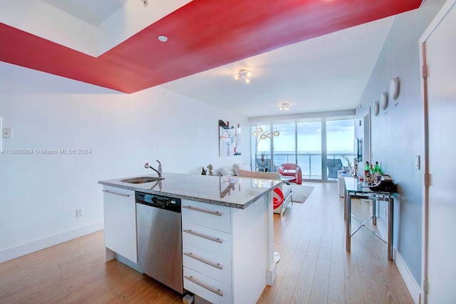 kitchen featuring stone countertops, white cabinets, dishwasher, a water view, and light hardwood / wood-style flooring