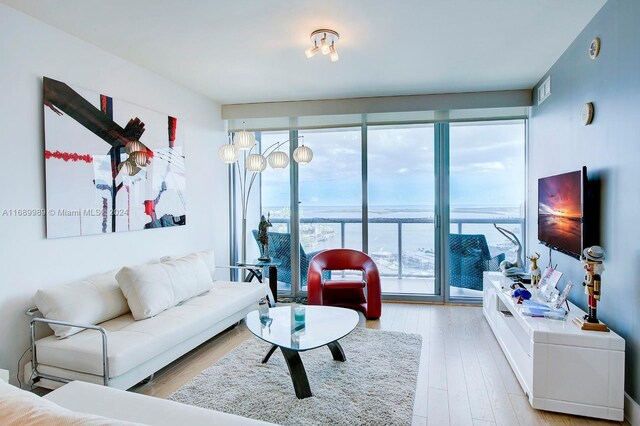 888 Biscayne Blvd Unit 4007, Miami, FL 33132 - living area with light wood-style floors and floor to ceiling windows