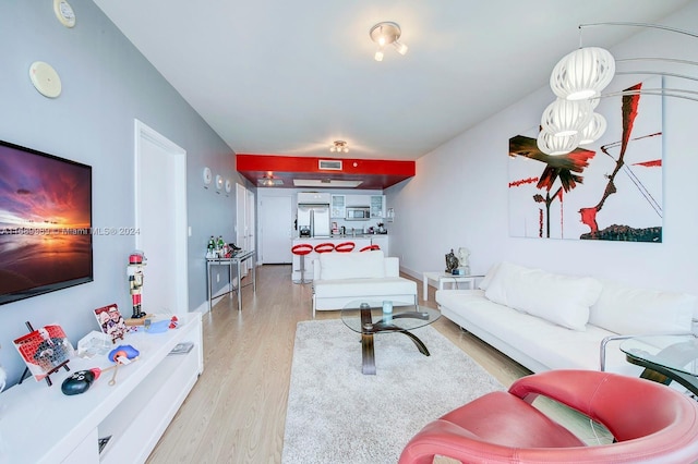 living room with light hardwood / wood-style floors