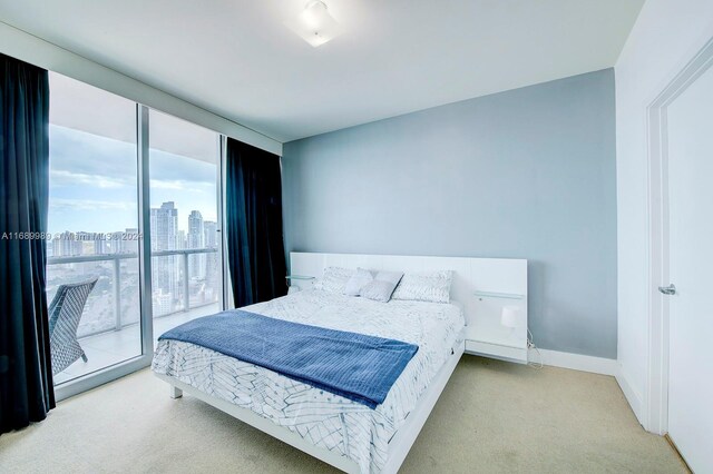 888 Biscayne Blvd Unit 4007, Miami, FL 33132 - carpeted bedroom with baseboards and a city view