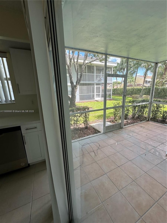 unfurnished sunroom featuring a wealth of natural light