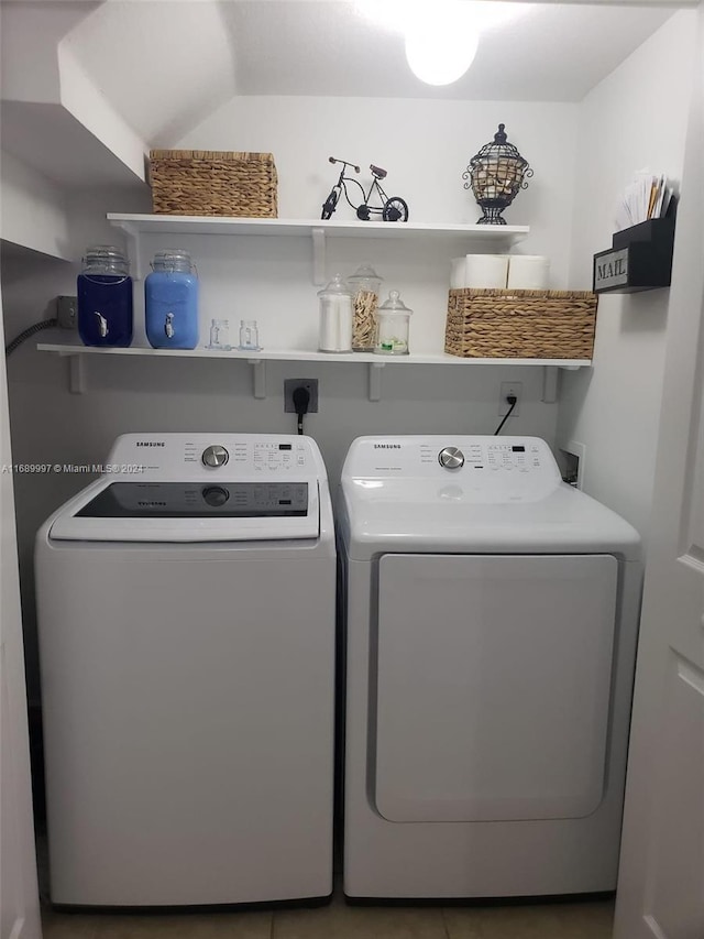 clothes washing area with independent washer and dryer