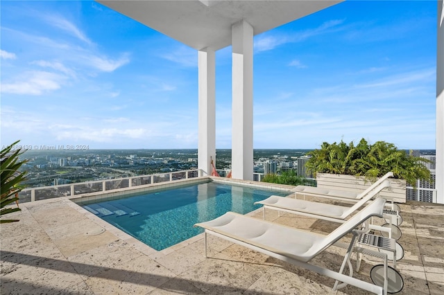 view of swimming pool featuring a patio area