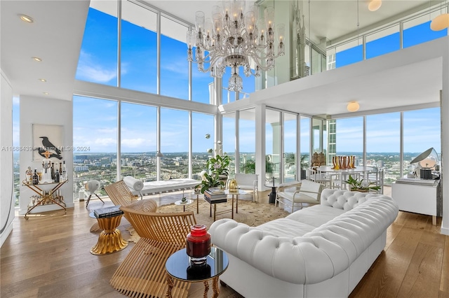 sunroom / solarium featuring a notable chandelier