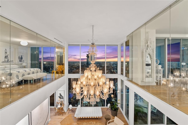 interior space featuring hardwood / wood-style flooring and a chandelier