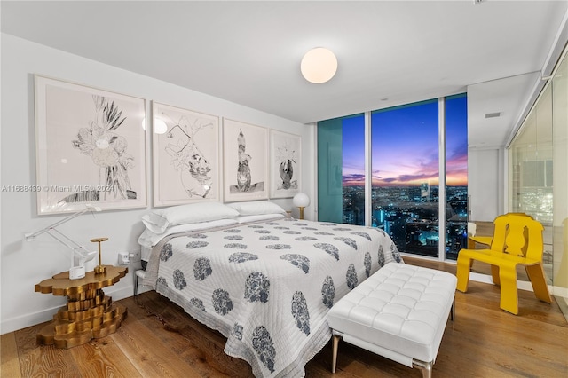 bedroom with hardwood / wood-style flooring