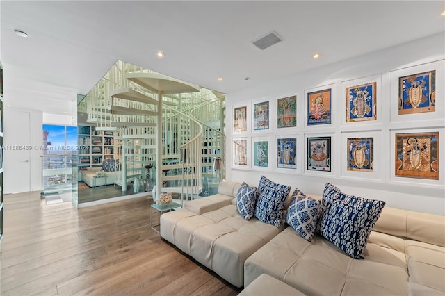 living room featuring expansive windows and wood-type flooring