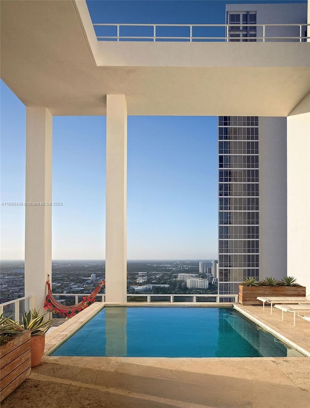 view of swimming pool featuring a patio area